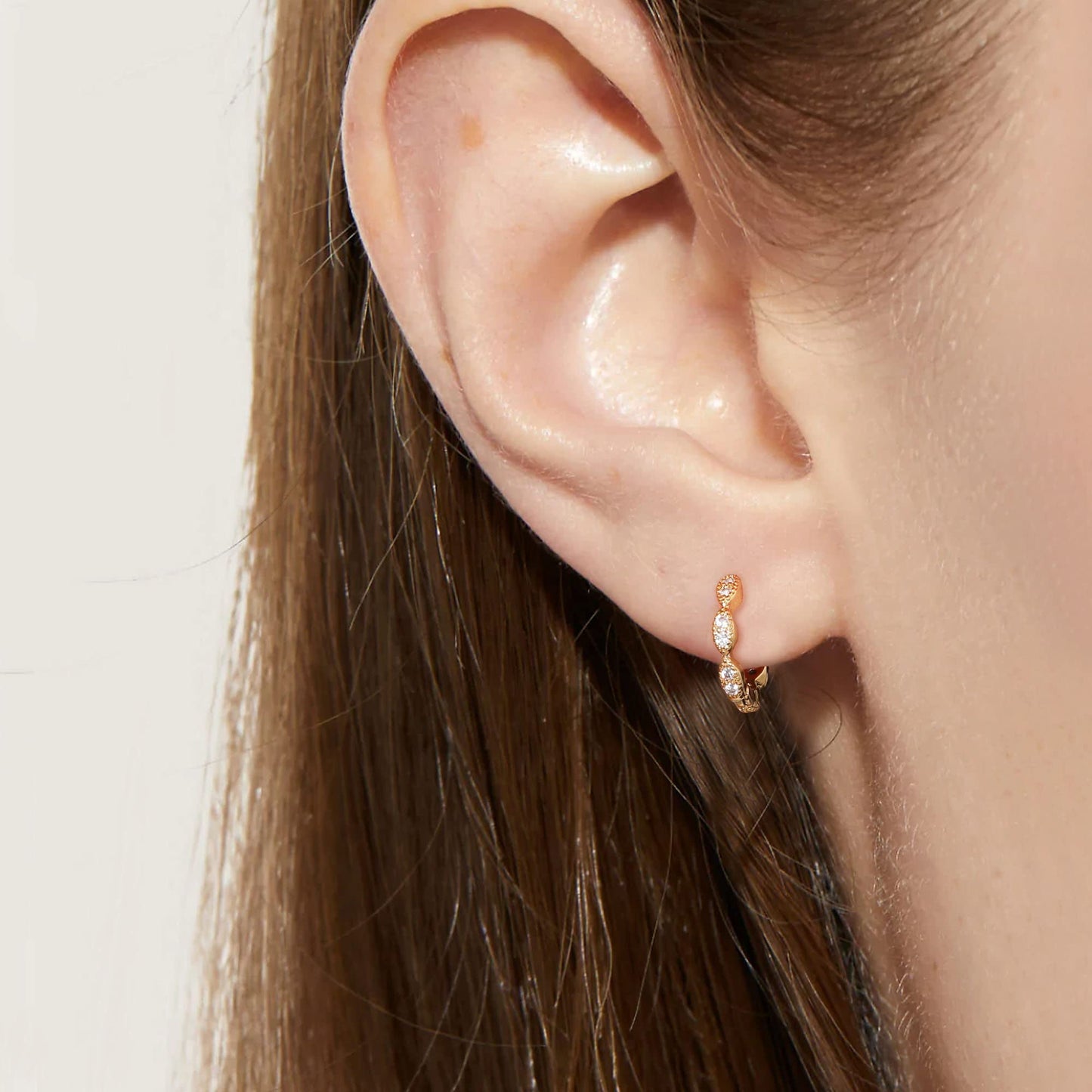 18K Gold CZ Wave Huggie Earrings